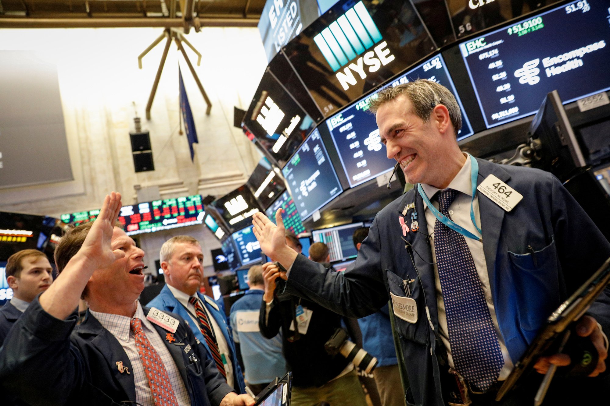 exuberant-traders.jpg The Dow jumps as much as 400 points