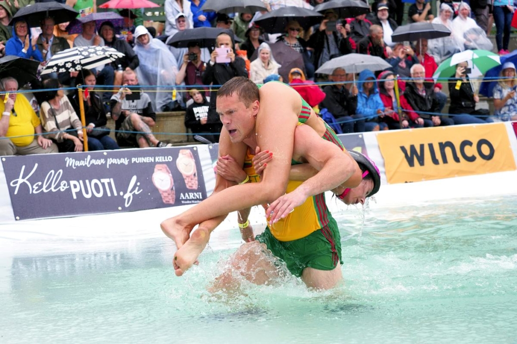 Lithuanian couple defends world wife-carrying championship title